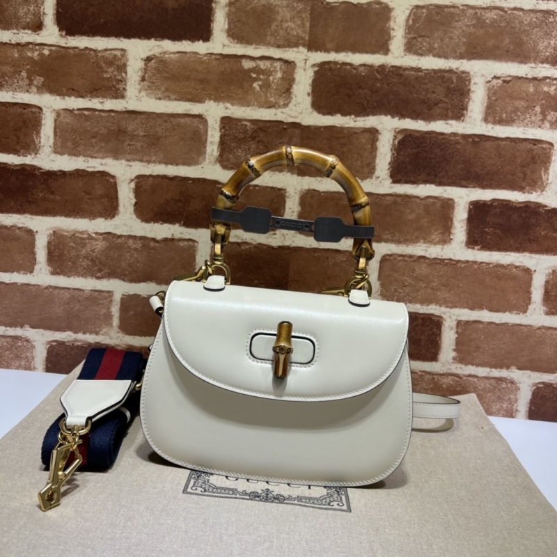 G*u*i top handle bags
